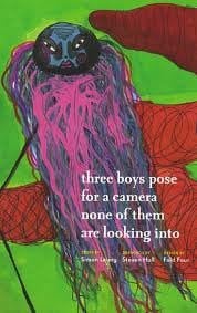 Three Boys Pose for a Camera None of them are Looking Into