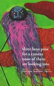 Three Boys Pose for a Camera None of them are Looking Into